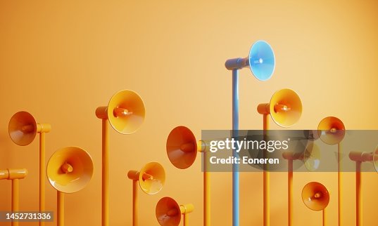 Blue colored megaphone standing out from the crowd Blue colored megaphone standing out from the crowd