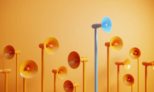 blue colored megaphone standing out from the crowd - communication stock pictures, royalty-free photos & images