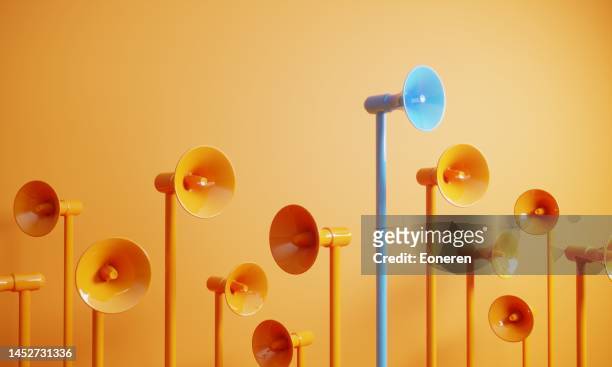 blue colored megaphone standing out from the crowd - marketing stock pictures, royalty-free photos & images