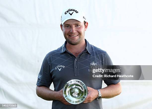 Branden Grace of South Africa receives the European Tour Golfer of the Month Award for January during the second round of the BMW PGA Championship on...