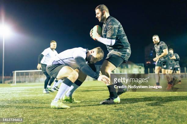 rugby team on evening practice. tackle - rugby union tournament imagens e fotografias de stock
