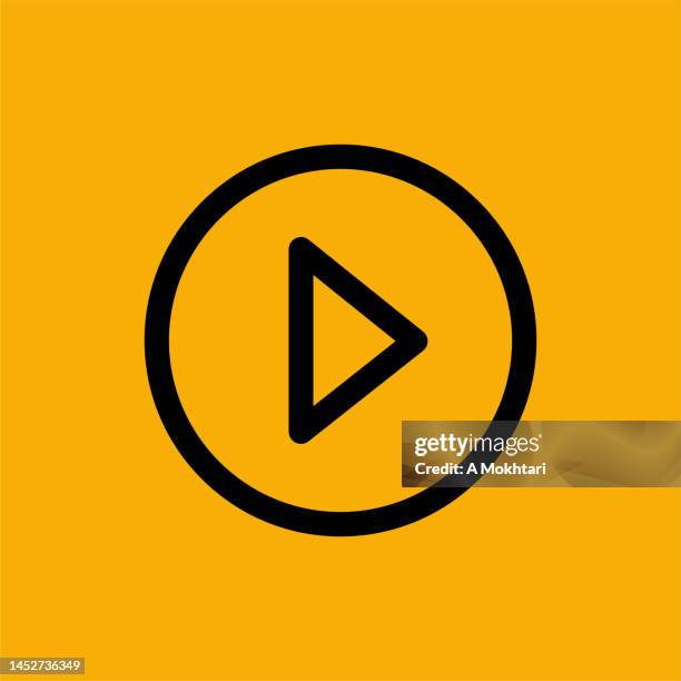 play button icon on yellow background. - video play button stock illustrations