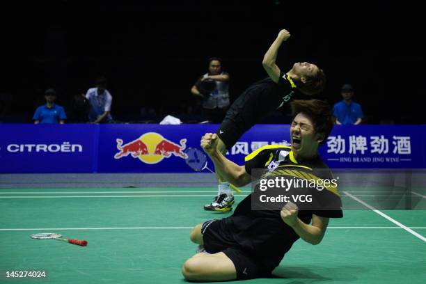 Yong Dae Lee and Sa Rang Kim of South Korea celebrate after defeating Jonas Rasmussen and Joachim Fischer Nielsen of Denmark in the semi-final match...