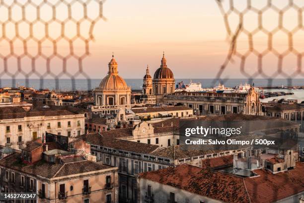 high angle view of buildings in city during sunset,catania,metropolitan city of catania,italy - catania stock pictures, royalty-free photos & images