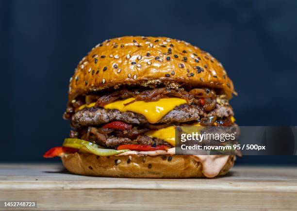 close-up of burger on table,indonesia - american cheese stock-fotos und bilder