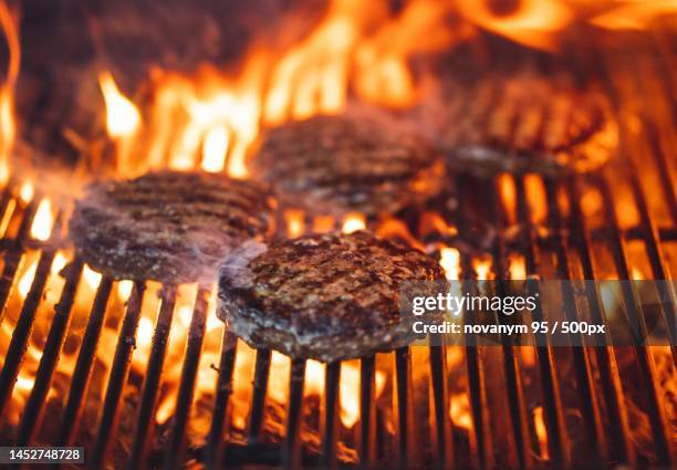 close-up of meat on barbecue grill,indonesia - burger on grill imagens e fotografias de stock