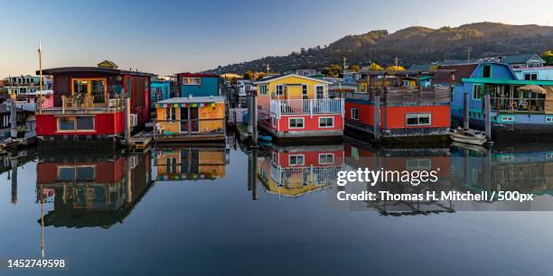 scenic view of lake by buildings against sky,charles van damme dock,united states,usa - sausalito stockfoto's en -beelden