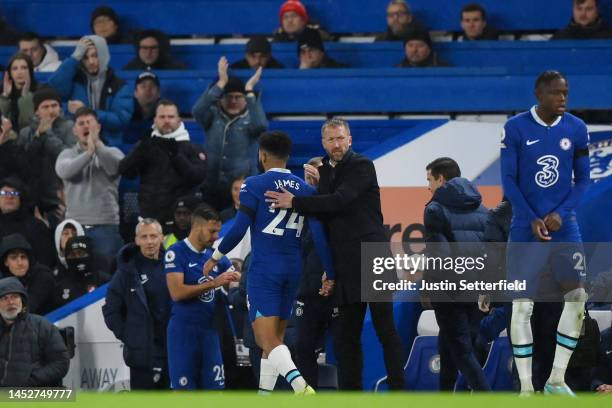 Reece James of Chelsea reacts with Graham Potter, Manager of Chelsea as they leave the pitch after picking up an injury during the Premier League...