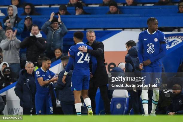 Reece James of Chelsea reacts with Graham Potter, Manager of Chelsea as they leave the pitch after picking up an injury during the Premier League...
