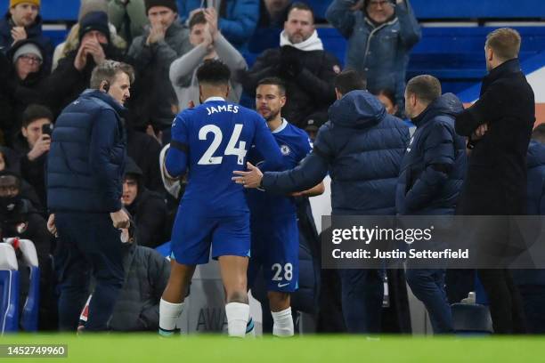 Reece James of Chelsea is replaced by team mate Cesar Azpilicueta after picking up an injury during the Premier League match between Chelsea FC and...