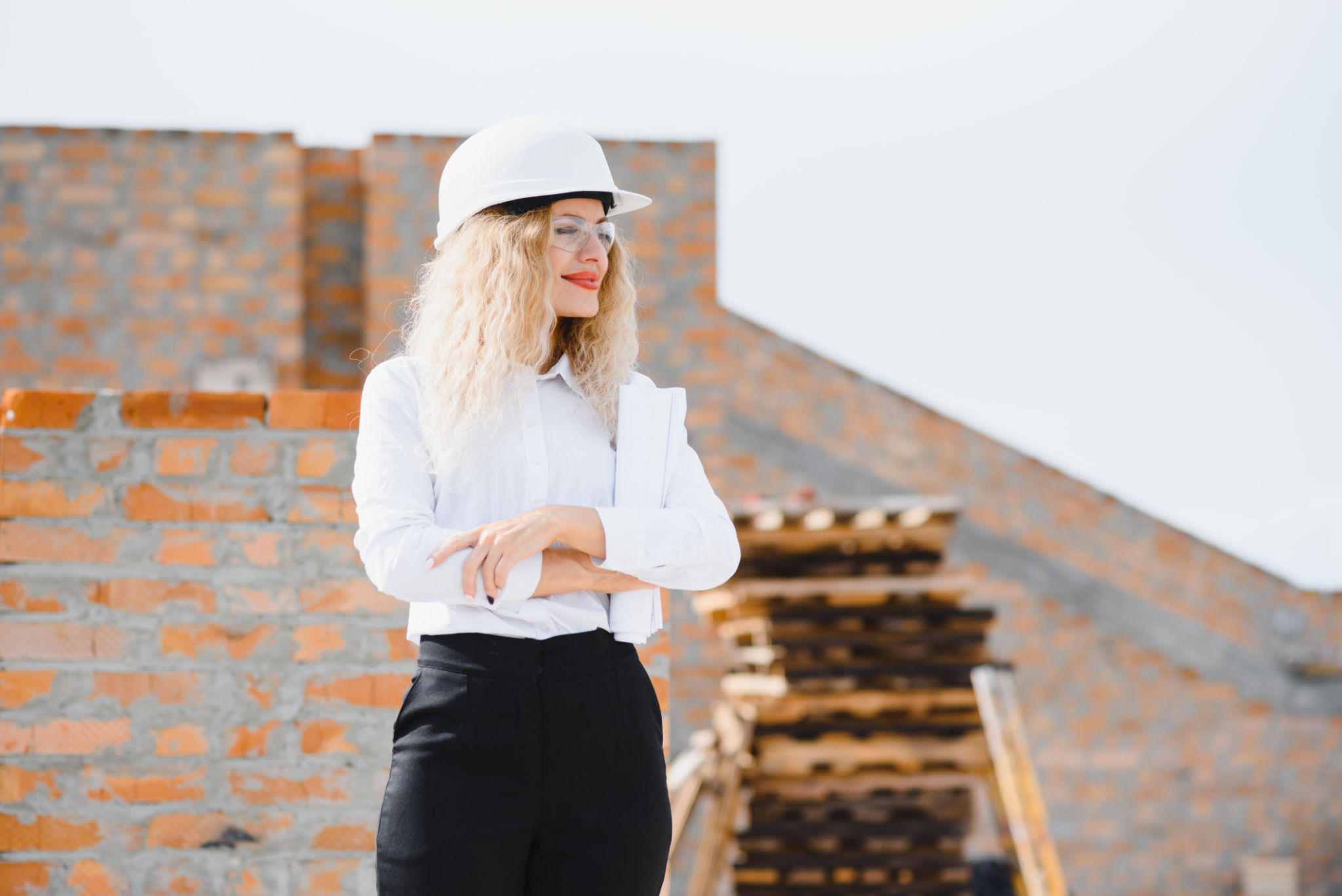 Women Engineer look at Building Glass. Women Engineer look at Building Glass.