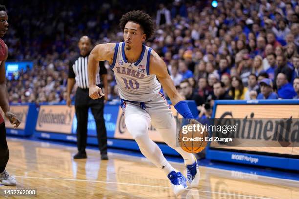 Jalen Wilson of the Kansas Jayhawks drives against the Harvard Crimson at Allen Fieldhouse on December 22, 2022 in Lawrence, Kansas.