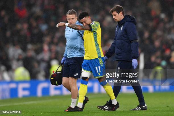Jesse Lingard of Nottingham Forest leaves the pitch with medical staff after picking up an injury during the Premier League match between Manchester...