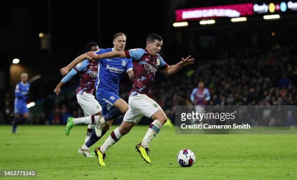 Josh Cullen of Burnley runs with the ball during the Sky Bet Championship between Burnley and Birmingham City at Turf Moor on December 27, 2022 in...