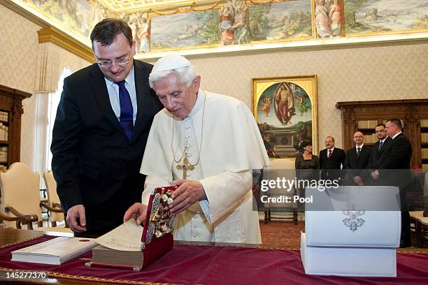 Pope Benedict XVI exchanges gifts with Prime Minister of the Czech Republic Petr Necas at his private library on May 25, 2012 in Vatican City,...