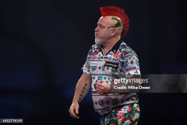 Peter Wright of Scotland celebrates winning the first set during his Third Round match against Kim Huybrechts of Belgium during Day Eight of The...