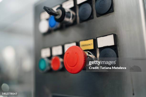 button on and off. red button valve on control panel of some steel construction machine - pivot stock pictures, royalty-free photos & images