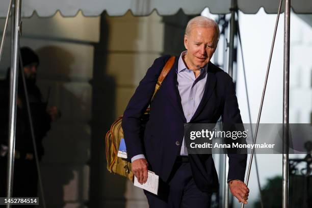 President Joe Biden walks to speak to reporters as he and first lady Jill Biden leave the White House and walk to Marine One on the South Lawn on...