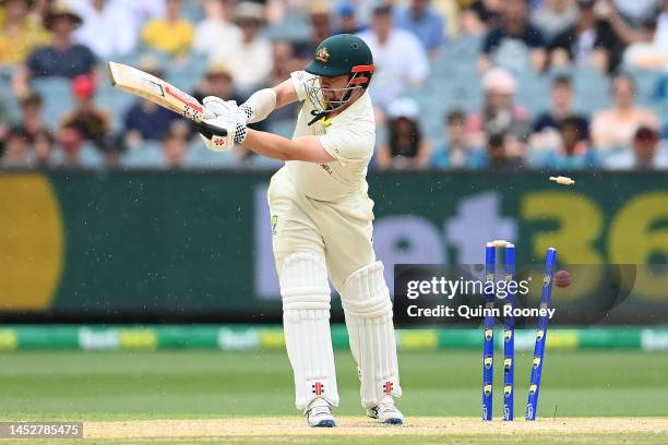 Travis Head of Australia is clean bowled by Anrich Nortje of South Africa during day three of the Second Test match in the series between Australia...