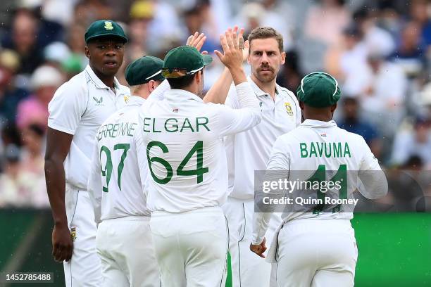 Anrich Nortje of South Africa celebrates with team mates after clean bowling Travis Head of Australia during day three of the Second Test match in...