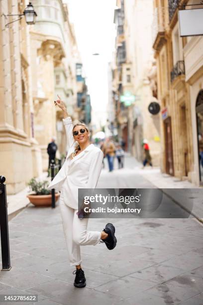attractive young woman posing in the city - malta business stock pictures, royalty-free photos & images