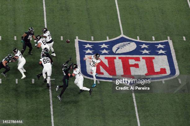 Aerial view of Quarterback Trevor Lawrence of the Jacksonville Jaguars passes the ball in the Thursday Night Football game in the rain between the...