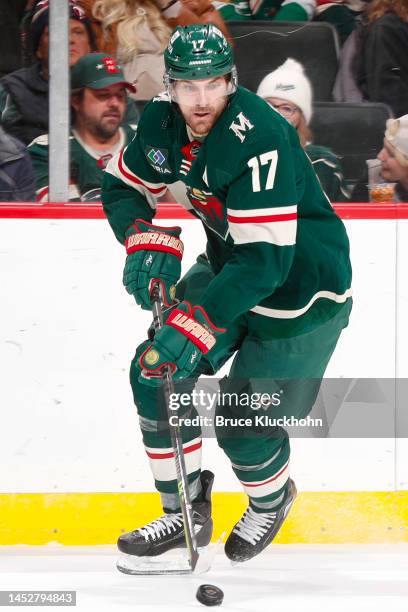 Marcus Foligno of the Minnesota Wild skates with the puck against the Ottawa Senators during the game at the Xcel Energy Center on December 18, 2022...