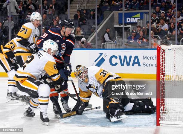 Tristan Jarry of the Pittsburgh Penguins makes the second period save on Anthony Beauvillier of the New York Islanders at the UBS Arena on December...