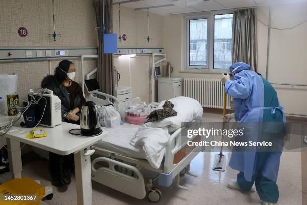 Worker cleans a room at the fever clinic of Beijing Chaoyang Hospital on December 27, 2022 in Beijing, China.