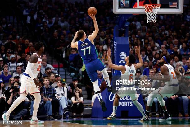 Luka Doncic of the Dallas Mavericks shoots against Quentin Grimes of the New York Knicks in the first half at American Airlines Center on December...