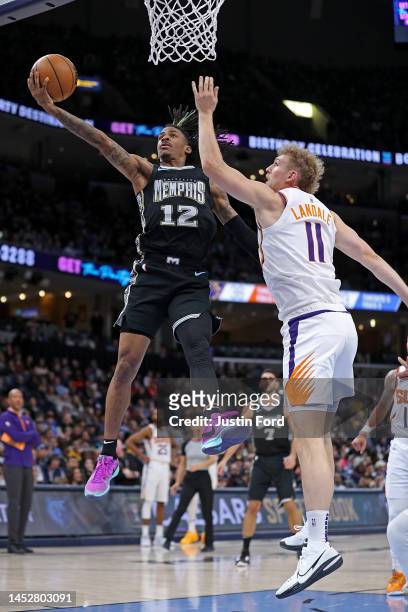Ja Morant of the Memphis Grizzlies goes to the basket against Jock Landale of the Phoenix Suns during the first half at FedExForum on December 27,...