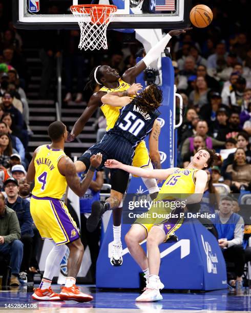 Cole Anthony of the Orlando Magic is called for a foul on Austin Reaves of the Los Angeles Lakers during the third quarter at Amway Center on...