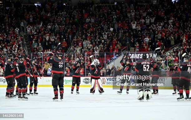 The Carolina Hurricanes perform a Storm Surge for the fans after their win against the Chicago Blackhawks at PNC Arena on December 27, 2022 in...