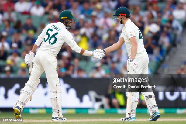 Cameron Green of Australia celebrates with Mitchell Starc after reaching a half century during day three of the Second Test match in the series...