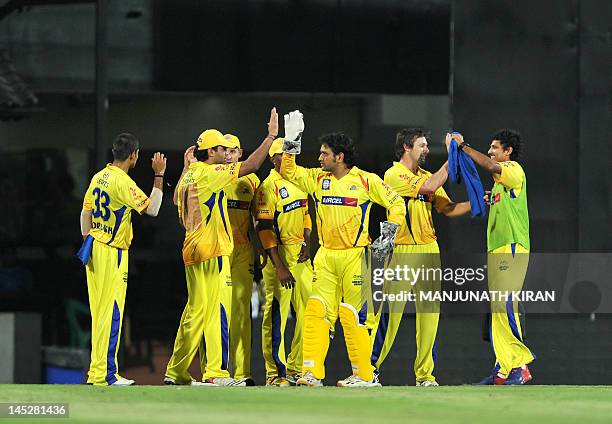 Chennai Super Kings teammates celebrate the catch dismissal of Delhi Daredevils batsman David Warner during the IPL Twenty20 cricket 2nd Qualifier...