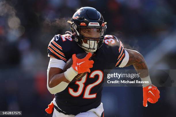 David Montgomery of the Chicago Bears runs with the ball against the Buffalo Bills at Soldier Field on December 24, 2022 in Chicago, Illinois.