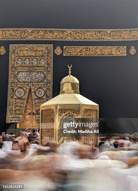 station of abraham or maqam e ibrahim inside masjid al haram where pilgrims do tawaaf of khaana kaaba for hajj and umrah | people wear ihram clothes for haj and umra, mecca, saudi arabia | prophet ibraheem - hajj pilgrim stock pictures, royalty-free photos & images
