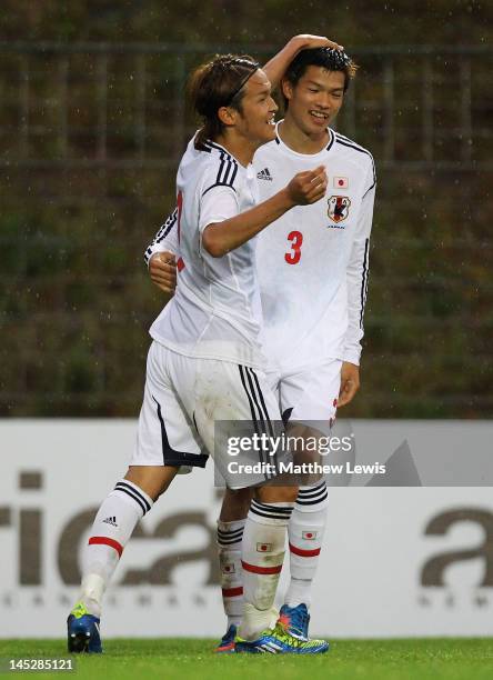 Takashi Usami of japan congratulates Takahiro Ohgihara on his goal during the Toulon Tournament Group A match between Japan and Netherlands at Stade...