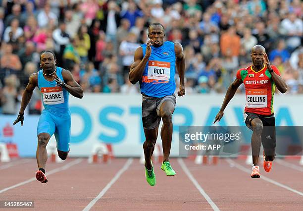 Jamaica sprinter Usain Bolt , Lerone Clarke of Jamaica and Kim Collins of Saint Kitts and Nevis, competes during the men's 100m race of the Zlata...