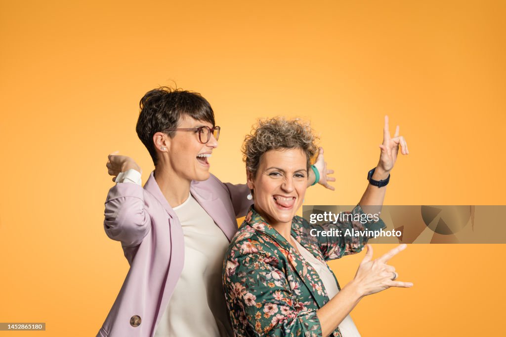 Dancing women with yellow background