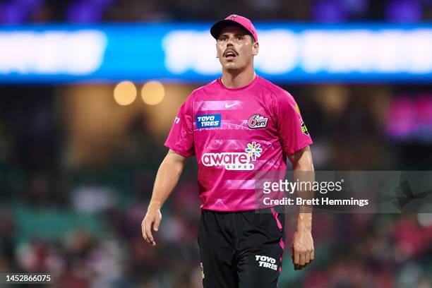 Ben Dwarshuis of the Sixers looks on during the Men's Big Bash League match between the Sydney Sixers and the Melbourne Renegades at Sydney Cricket...
