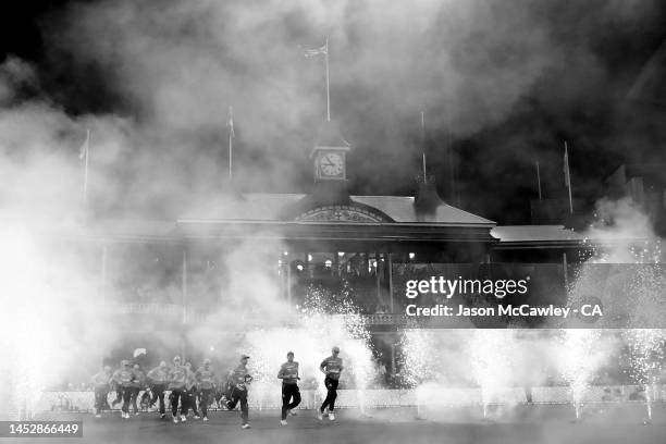 Sixers take to the field during the Men's Big Bash League match between the Sydney Sixers and the Melbourne Renegades at Sydney Cricket Ground on...