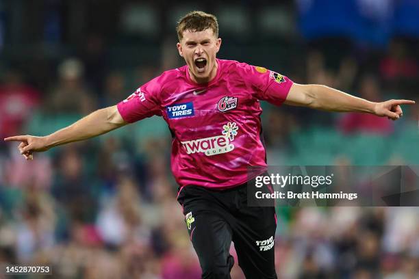 Hayden Kerr of the Sixers celebrates after taking the wicket of Shaun Marsh of the Renegades during the Men's Big Bash League match between the...