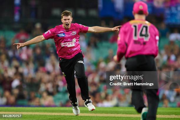 Hayden Kerr of the Sixers celebrates after taking the wicket of Shaun Marsh of the Renegades during the Men's Big Bash League match between the...