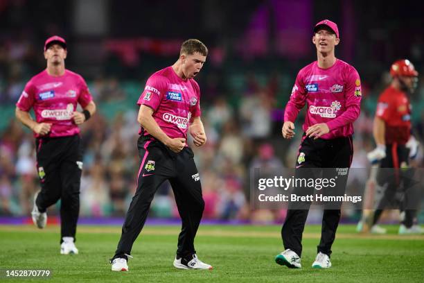 Hayden Kerr of the Sixers celebrates after taking the wicket of Shaun Marsh of the Renegades during the Men's Big Bash League match between the...