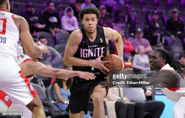 Mojave King of G League Ignite drives between Lucas Williamson and Keaton Wallace of the Ontario Clippers in the fourth quarter of their game at The...