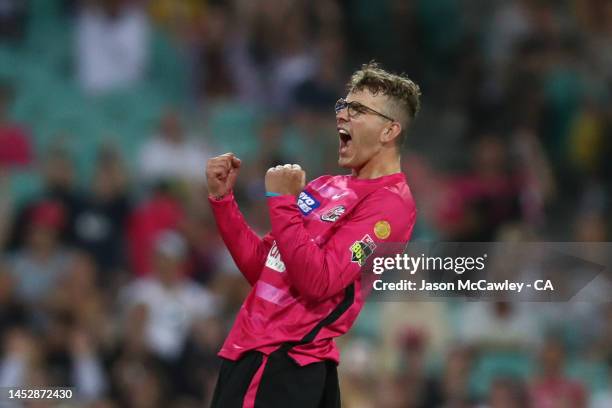 Todd Murphy of the Sixers celebrates after taking the wicket of Aaron Finch of the Renegades during the Men's Big Bash League match between the...