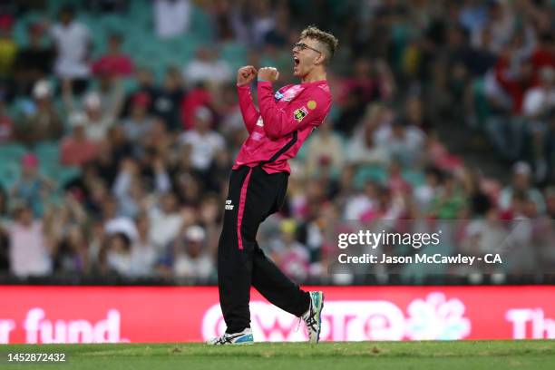 Todd Murphy of the Sixers celebrates after taking the wicket of Aaron Finch of the Renegades during the Men's Big Bash League match between the...