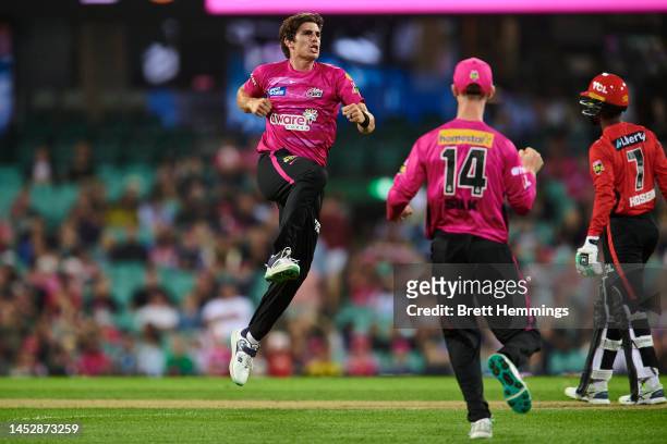 Sean Abbott of the Sixers celebrates after taking the wicket of Akeal Hosein of the Renegades during the Men's Big Bash League match between the...