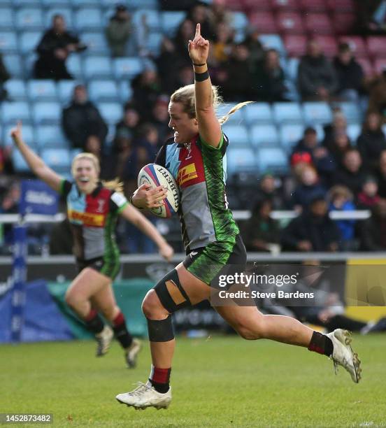 Bella McKenzie of Harlequins celebrates as she breaks away to score their 8th try during the Women's Allianz Premier 15s between Harlequins and...